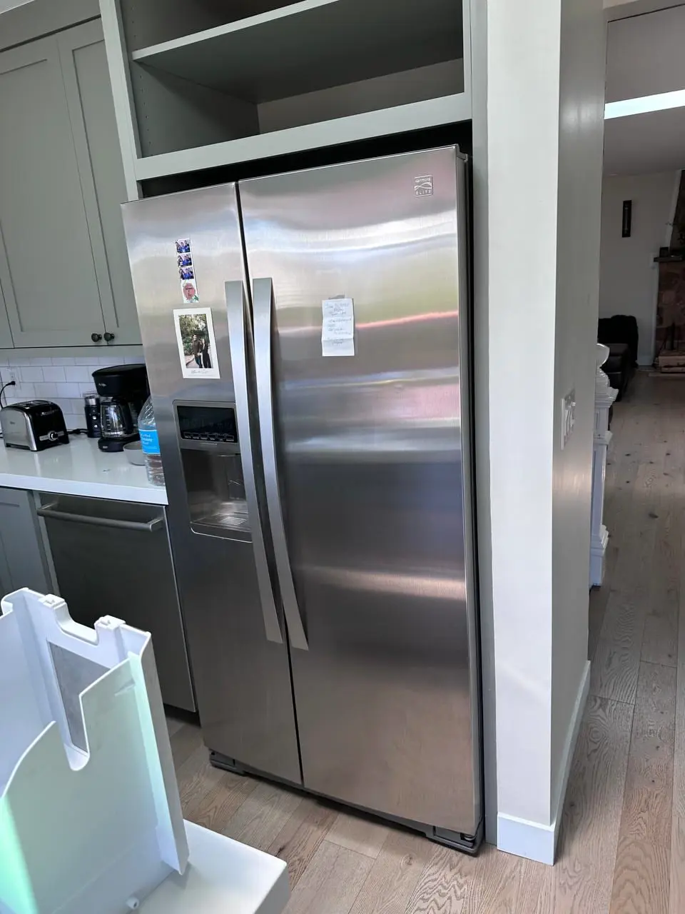 Stainless side-by-side refrigerator with water and ice dispenser — repaired by Marian Appliance Repair