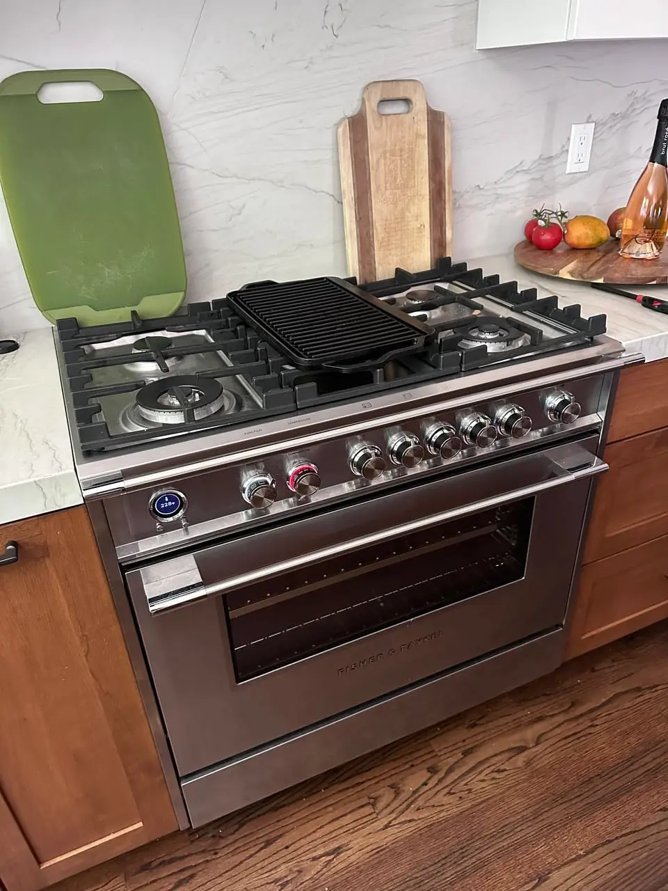 Professional dual-fuel range with a built-in griddle — repaired by Marian Appliance Repair