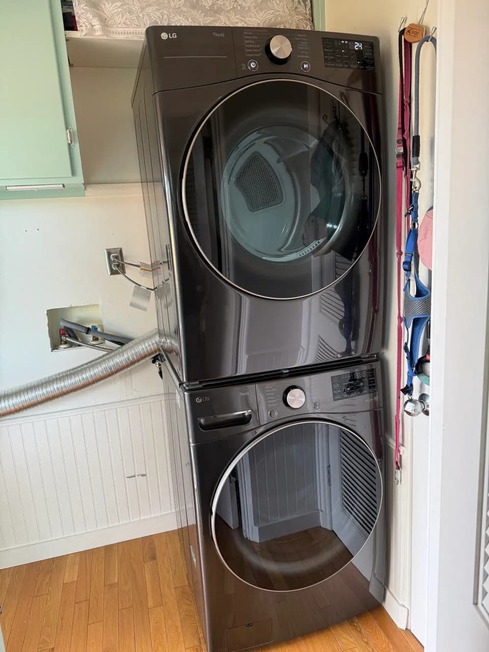 Stacked washer and dryer installed in a laundry closet — repaired by Marian Appliance Repair