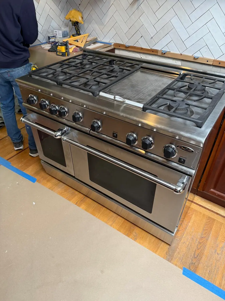 48-inch professional gas range during installation — repaired by Marian Appliance Repair